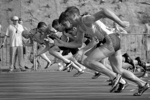 monochrome image of runners in race